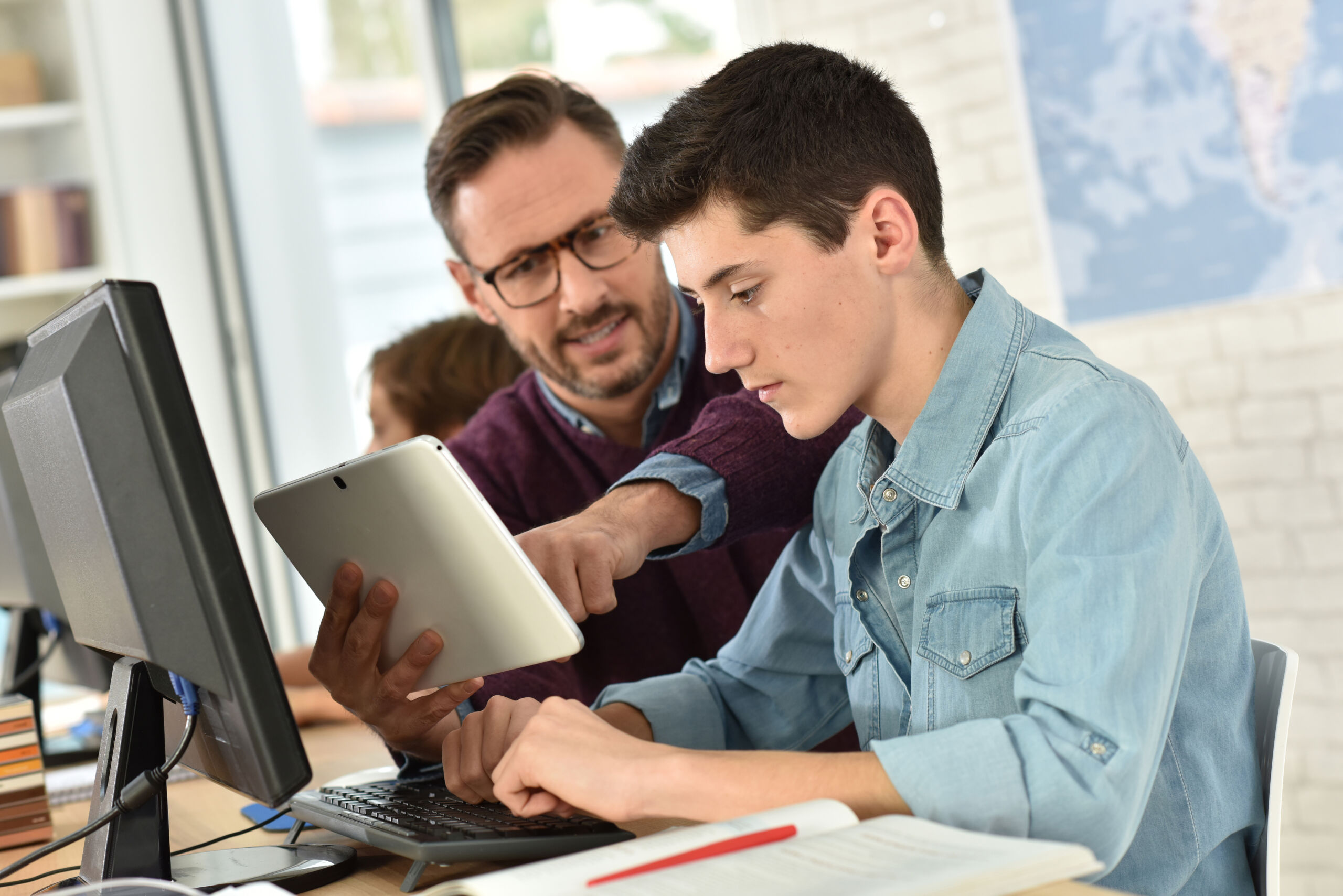Educator providing personalized guidance to a student